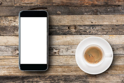 Directly above shot of coffee cup on table