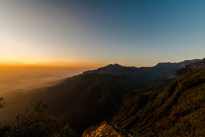 Scenic view of mountains against sky during sunset