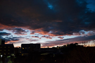 Houses against sky at night