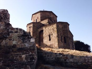 Low angle view of historic building against clear sky