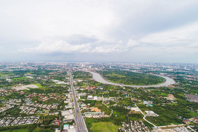 High angle view of city buildings against sky