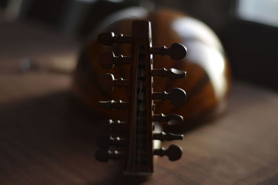 Close-up of string instrument on table