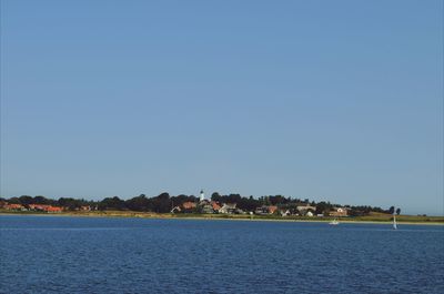 Scenic view of calm sea against clear sky