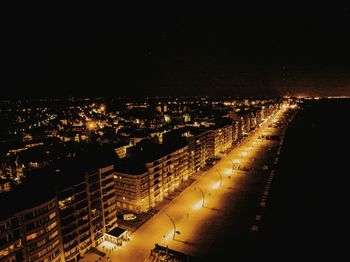 Aerial view of illuminated city at night