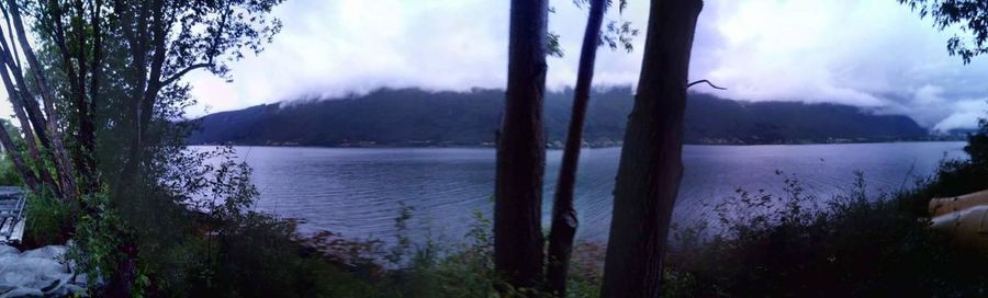 Scenic view of lake and mountains against sky