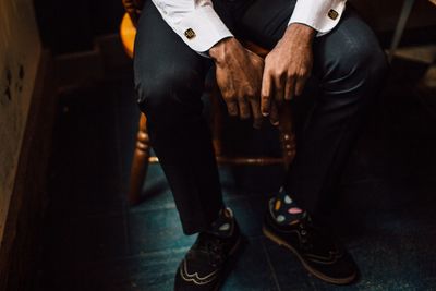 Low section of man sitting on chair