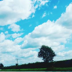 Scenic view of landscape against cloudy sky