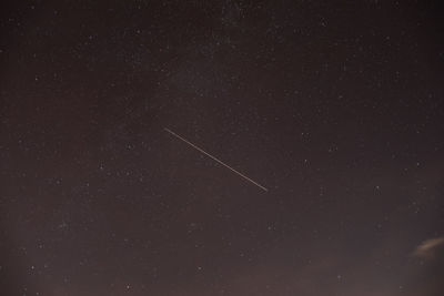 Low angle view of vapor trails in sky