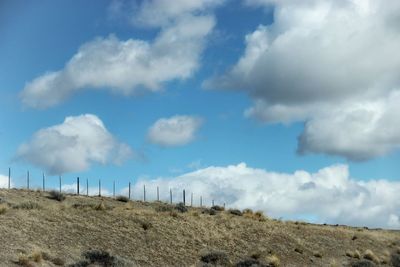 Panoramic view of field against sky