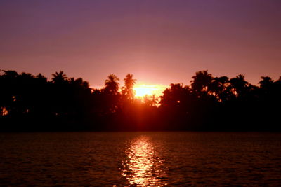 Scenic view of sunset over river