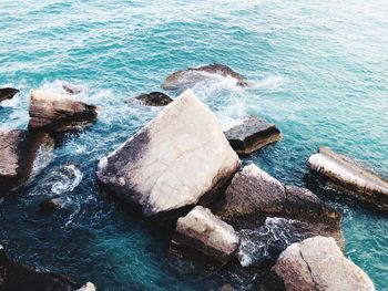 High angle view of rocks in sea