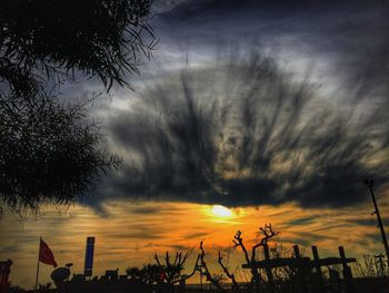 Low angle view of cloudy sky at sunset