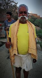 Portrait of man standing outdoors