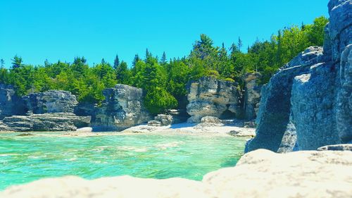 Scenic view of rock formation against blue sky