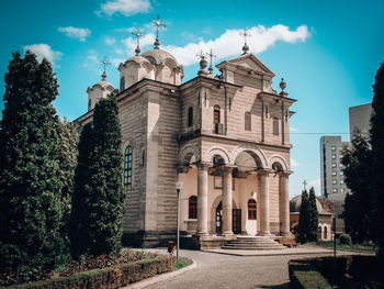 Facade of historic building against sky