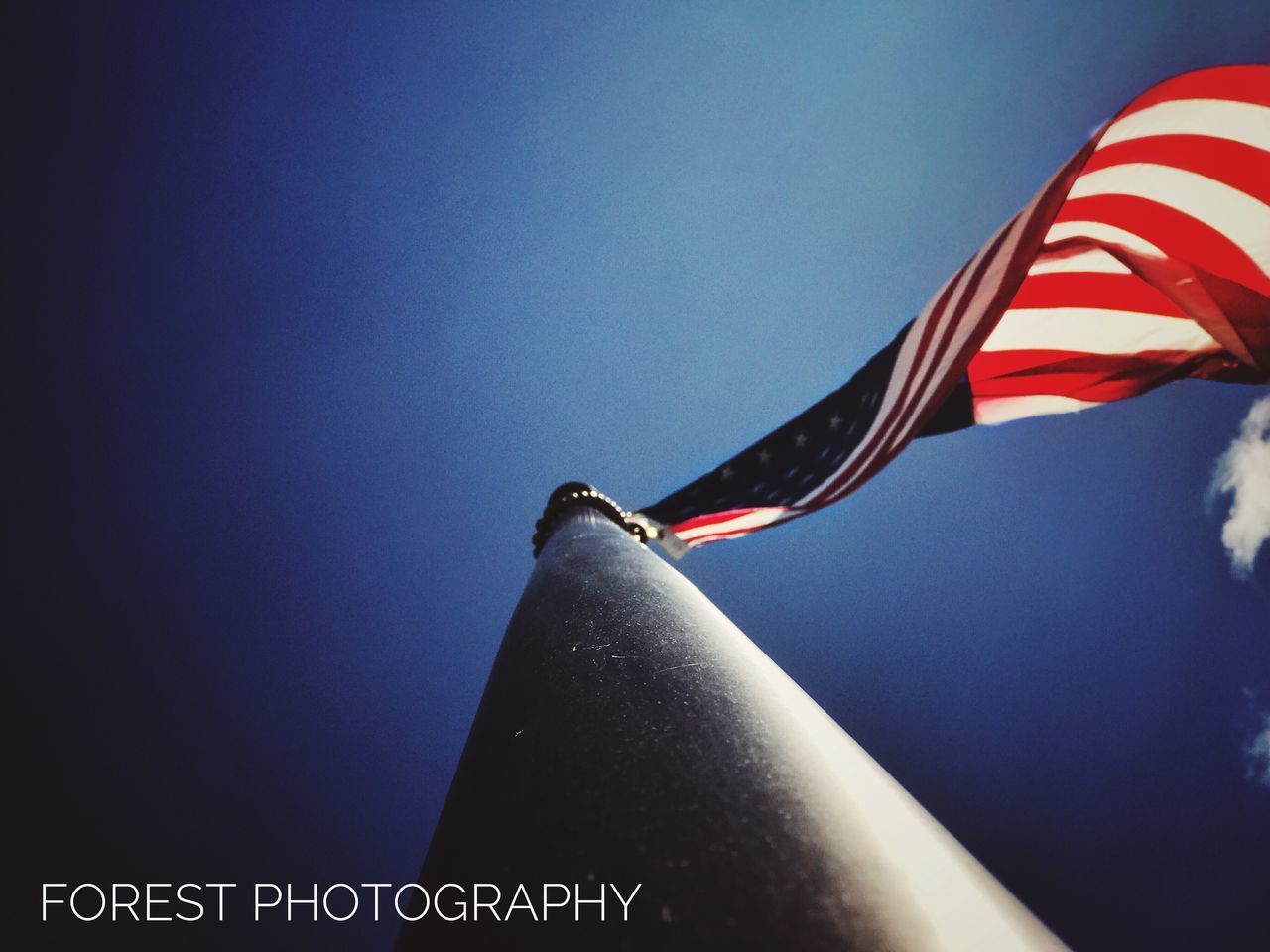 flag, patriotism, no people, clear sky, low angle view, day, blue, flag pole, outdoors, wind, sky, stars and stripes, close-up