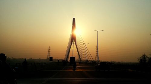 Signature bridge against sky during sunrise