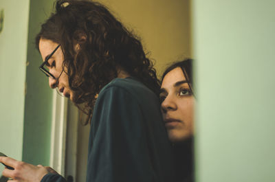 Side view of young couple looking at home