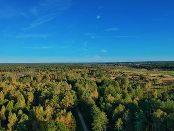 Scenic view of landscape against blue sky