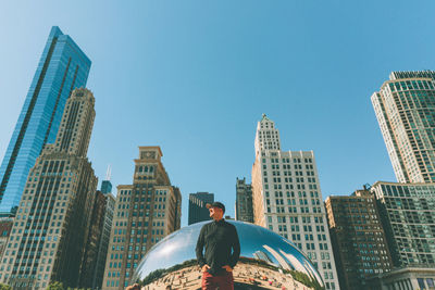 Low angle view of skyscrapers against clear blue sky