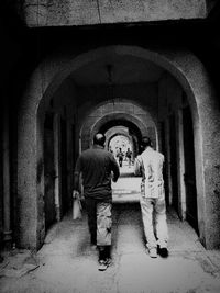 People walking in tunnel