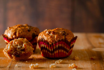 Freshly baked homemade muffins with raisins and carrots. vegetarian pastries on a wooden background. 