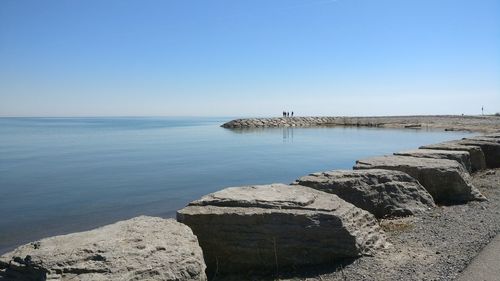 Scenic view of sea against clear blue sky