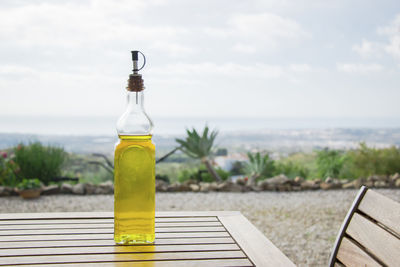 Close-up of olive oil on table