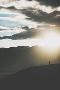 Scenic view of silhouette mountains against sky