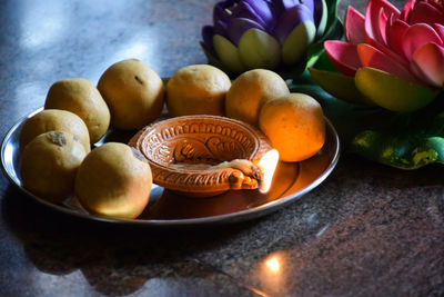 Close-up of apples in container on table