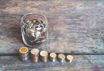 High angle view of coins on table