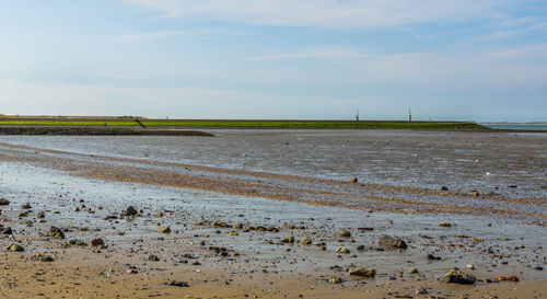 Scenic view of beach against sky