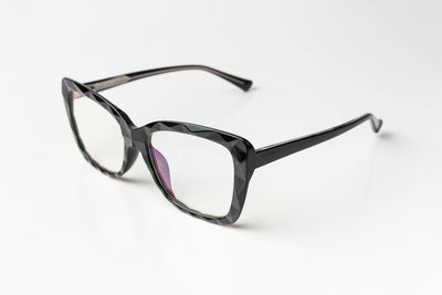 Close-up of sunglasses against white background