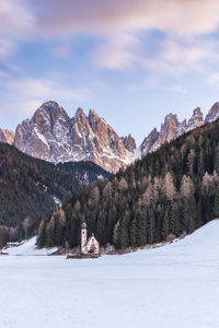 Scenic view of snow covered mountains against sky