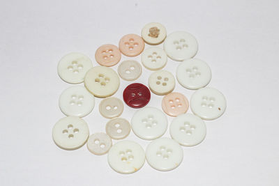 High angle view of buttons on white background