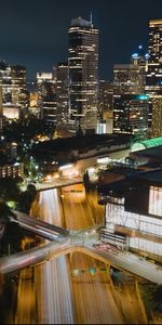 High angle view of illuminated buildings in city at night