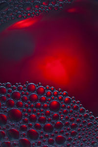 Close-up of strawberry over water against gray background