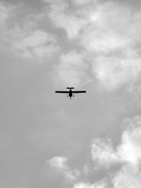 Low angle view of airplane in sky