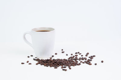 Close-up of coffee cup over white background