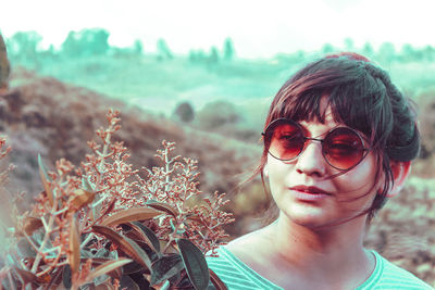 Portrait of young woman in sunglasses