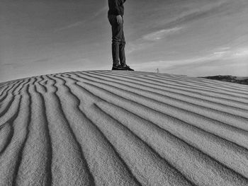 Standing in sand dunes on desert