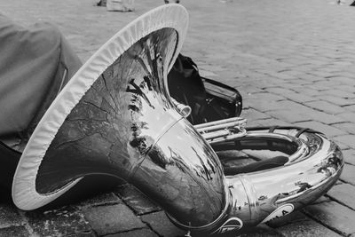 High angle view of abandoned bicycle on footpath
