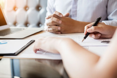 Close-up of man working on table