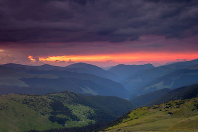 Scenic view of mountains against sky during sunset