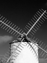 Low angle view of wind turbine against sky
