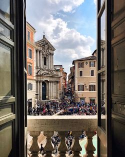 People in city against sky