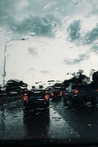 Cars on wet window during rainy season