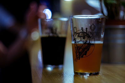 Close-up of beer glass on table