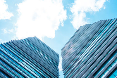 Low angle view of modern buildings against sky