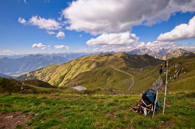 Scenic view of field and mountains against sky